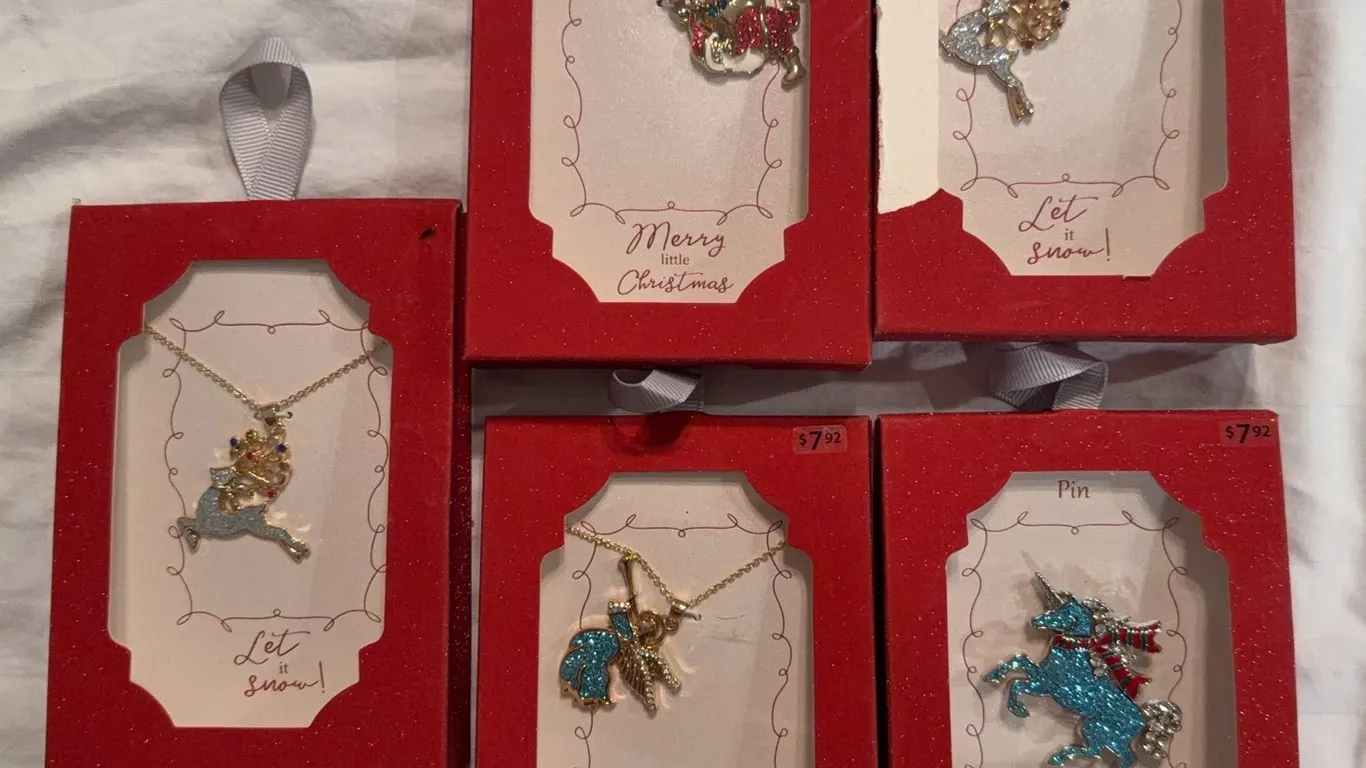 collection of festive holiday necklaces and pins