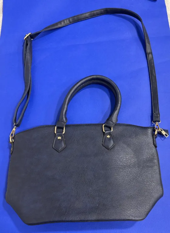 Navy Blue Handbag With Dual Handles and Crossbody Strap