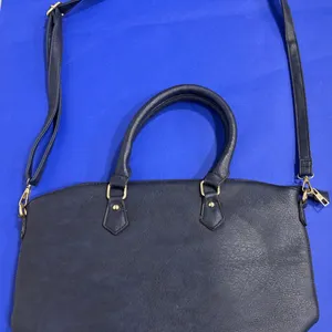 Navy Blue Handbag With Dual Handles and Crossbody Strap