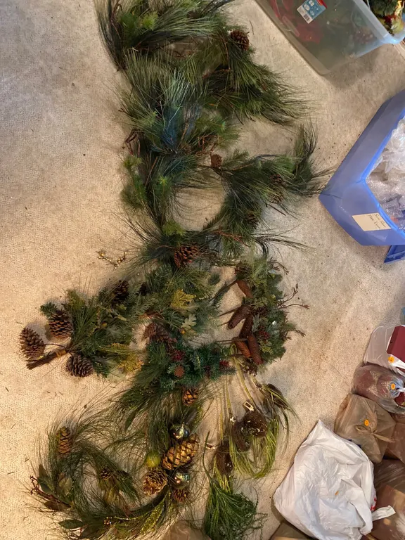 Artificial Holiday Floral Decorations Featuring Reds and Golds