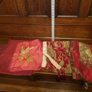 Red and Gold Decorative Textiles With Embroidered Designs