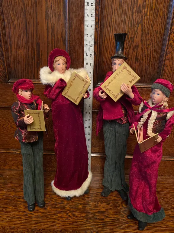 Four Victorian-Style Caroler Figurines in Holiday Attire