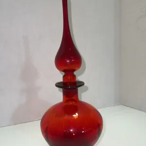 Vibrant red decanter with dramatic teardrop stopper