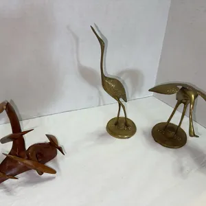 Unique small wood bird sculpture and brass cranes