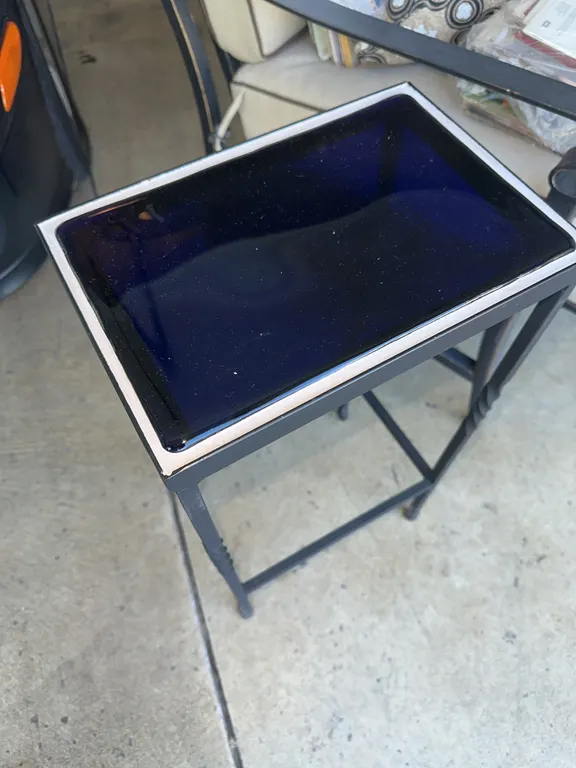Unusual glass top outdoor table
