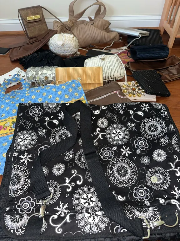 Two Vera Bradley garment bags, purses, etc.