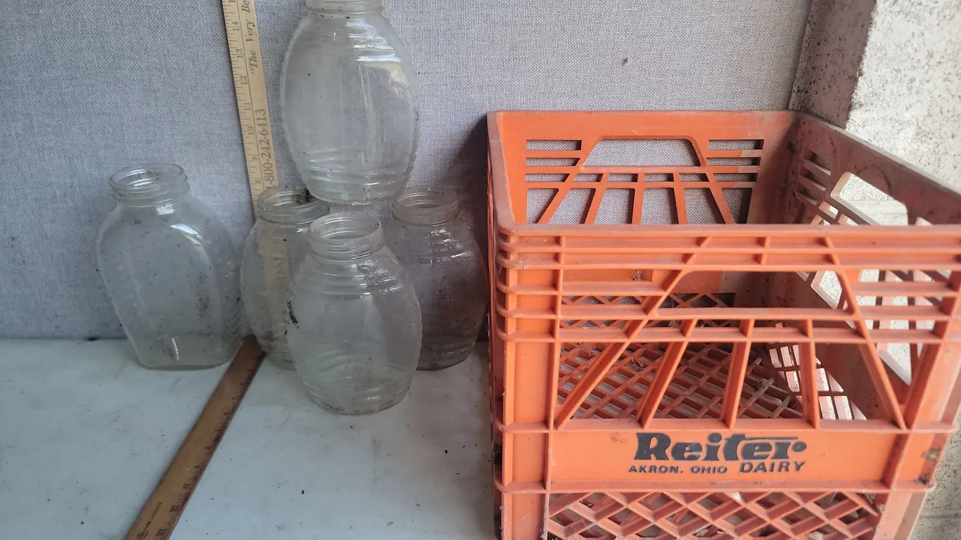 Plastic Milk Crate & Glass Honey Jars