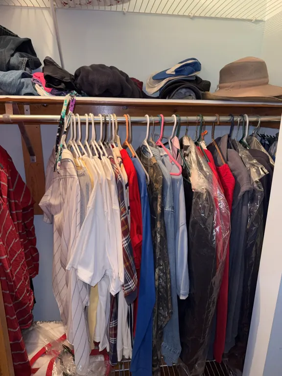 Large closet, clean out, including blankets, pants, jeans, and shirts