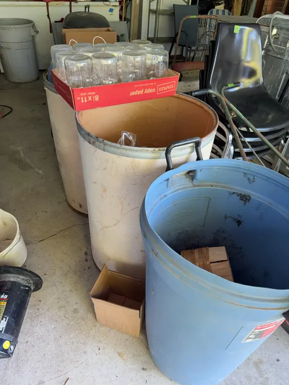 Trash can filled with mason jars