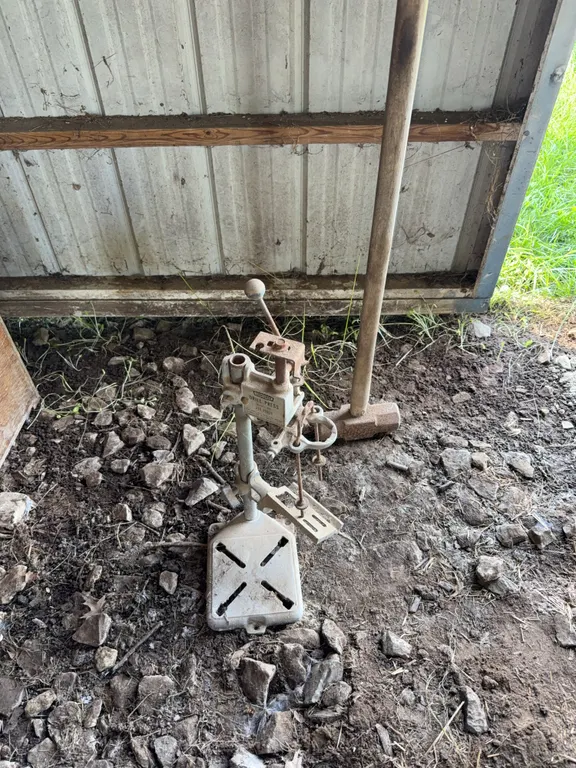 Old school manual drill press and sledge hammer
