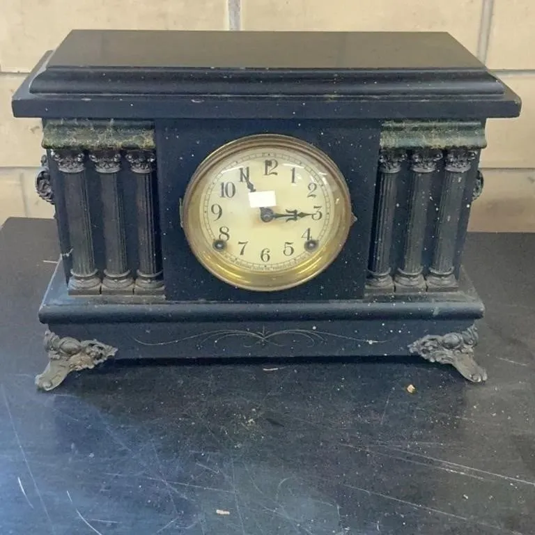 Antique Black Mantel Clock with Columns and Brass