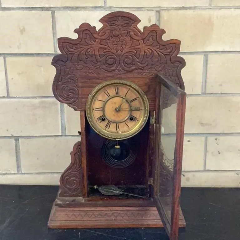 Antique Wooden Mantel Clock with Ornate Carvings