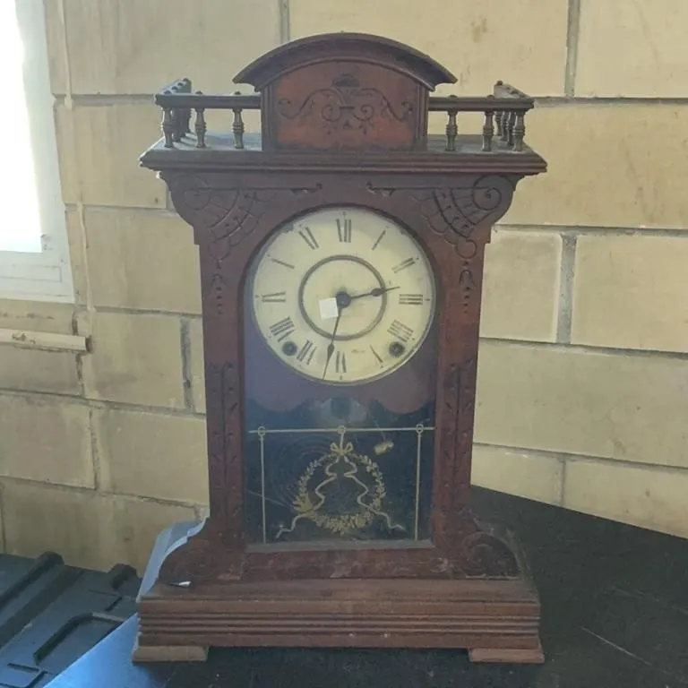 Antique Wooden Mantel Clock with Ornate Details