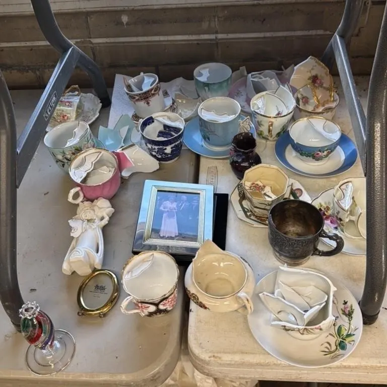 Broken Porcelain Teacups and Saucers Photo e