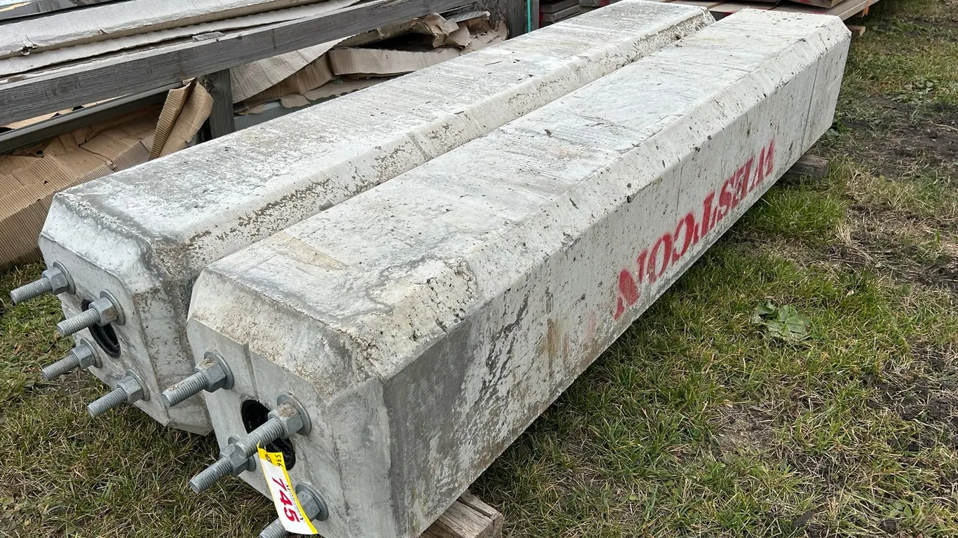 PAIR OF WESTCON PRECAST CONCRETE LIGHT STANDARDS 7FT X 16" X 16" W/ 6.5" X 6.5" BOLT PATTERN