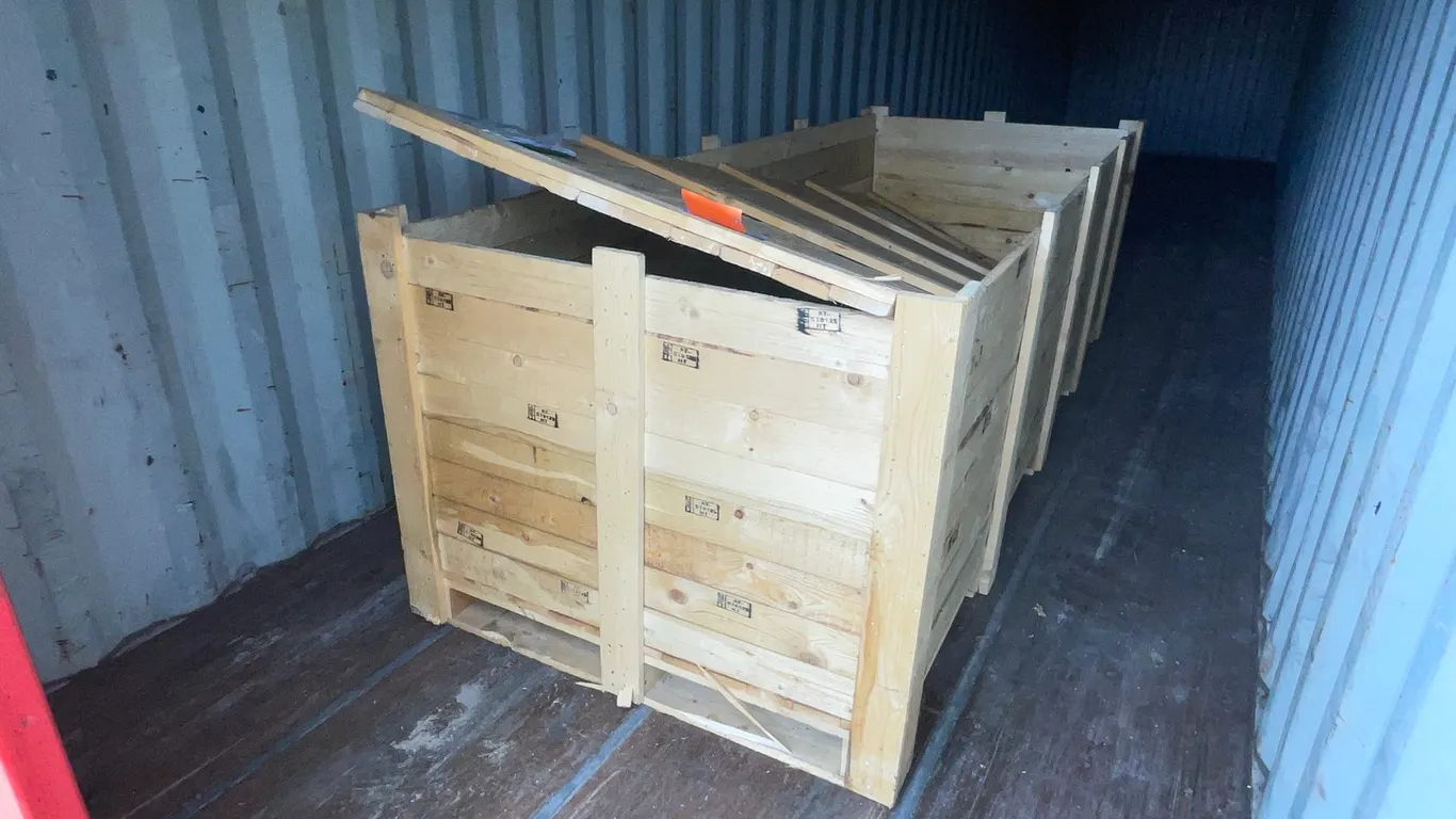 Various Pieces of Metal in Wood Crate