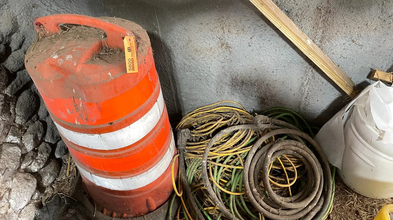 Safety Barrel and Large Pile of Extension Cords