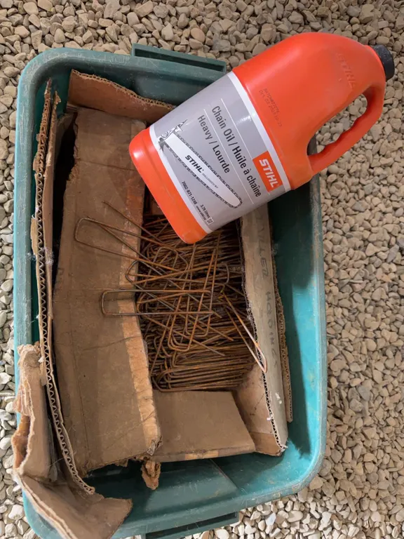 STIHL Chain Oil With Metal Wire landscaping Stakes and assorted wires
