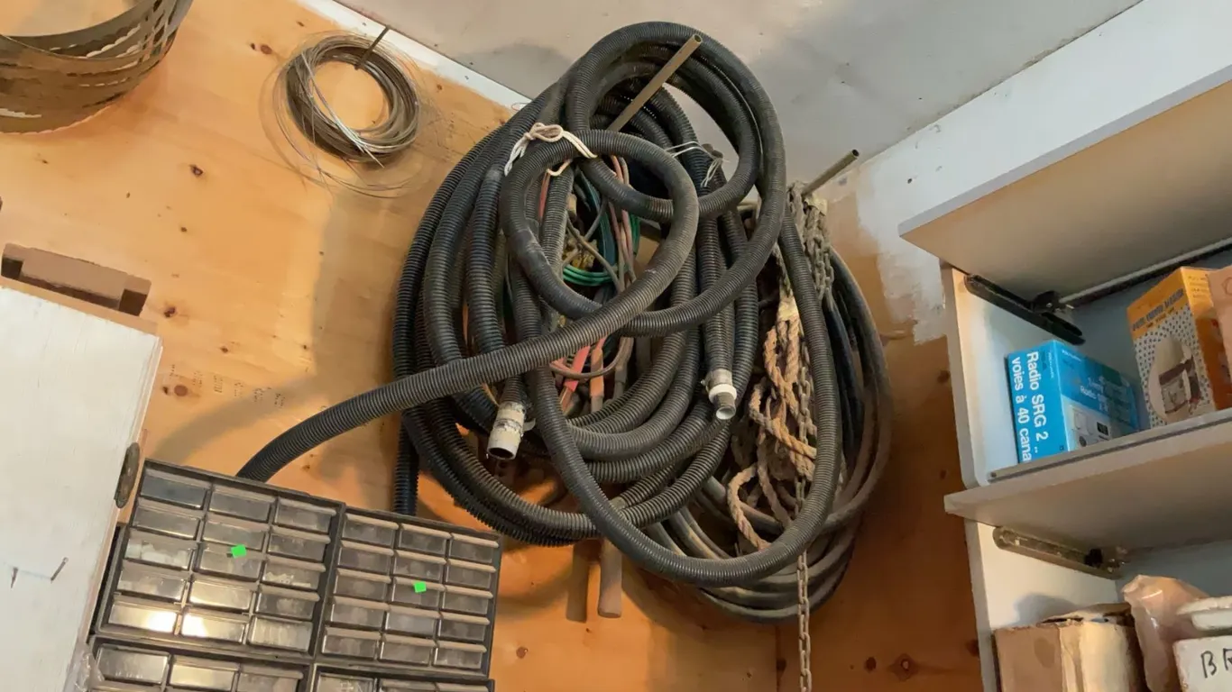 Wood Shop Wall-Mounted Lot with Hoses, Sump Pump, Chains, Wires and Rope