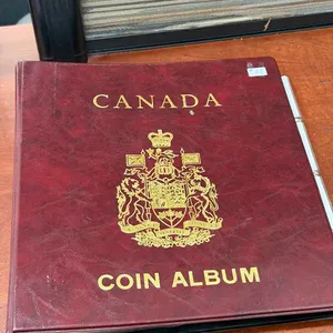 Coin Album with Cdn 1 cent and 5 cent