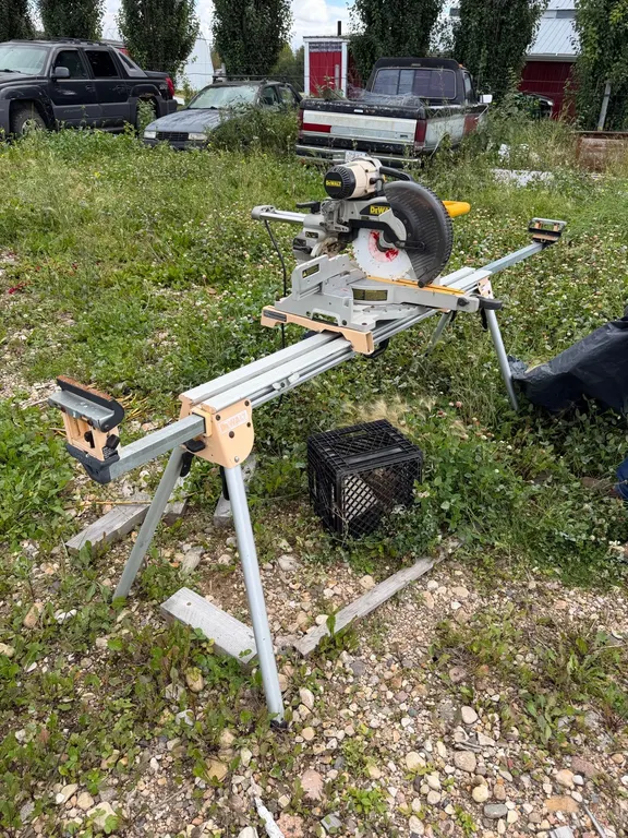 Dewalt 12” Mitre Saw and Stand *See Pictures **This item SOLD LIVE ON-SITE ONLY!!