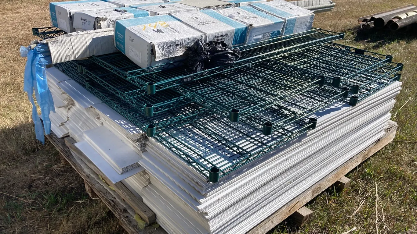 (12) Boxes of Beige Vinyl Flooring Large Quantity of Sign Boards and Wire Racking