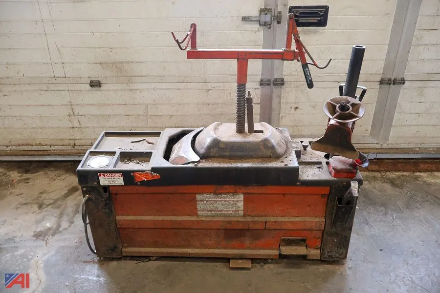Coats Pneumatically Powered Center-Post Tire Changer with Branick Strut Spring Compressor