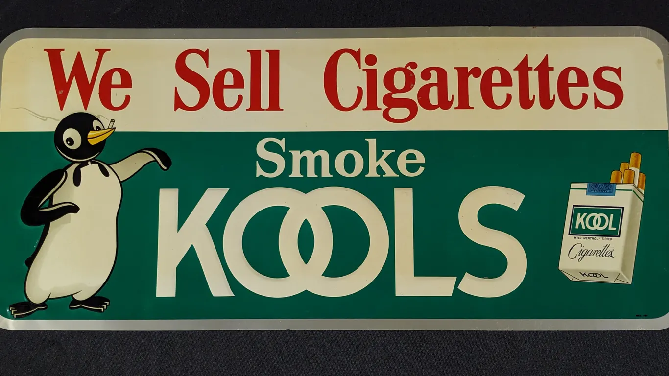 EMBOSSED TIN SIGN WE SELL CIGARETTES SMOKE KOOLS KOOL (PENGUIN)