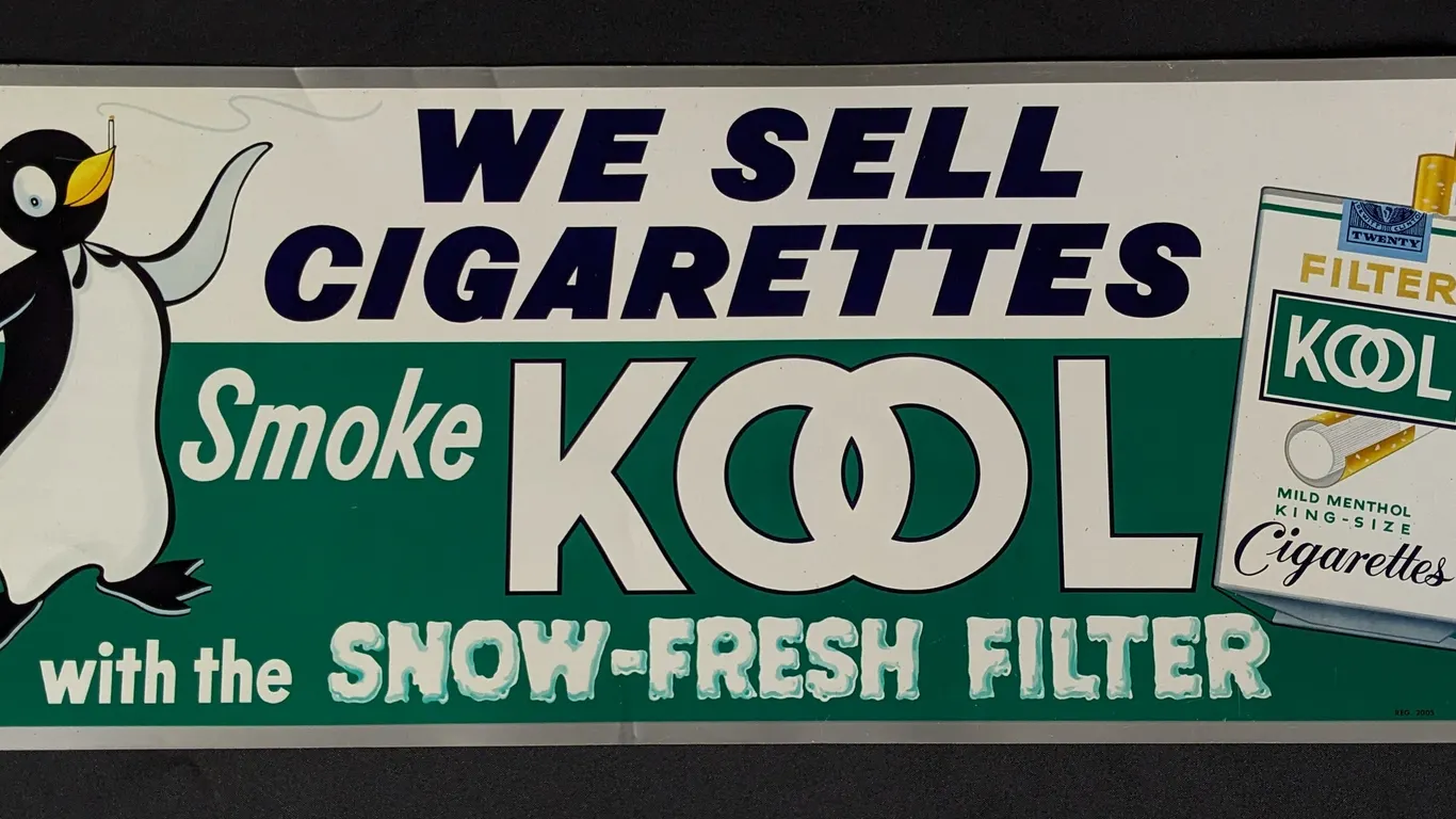 TIN SIGN WE SELL CIGARETTES SMOKE KOOL WITH THE SNOW-FRESH FILTER (PENGUIN)