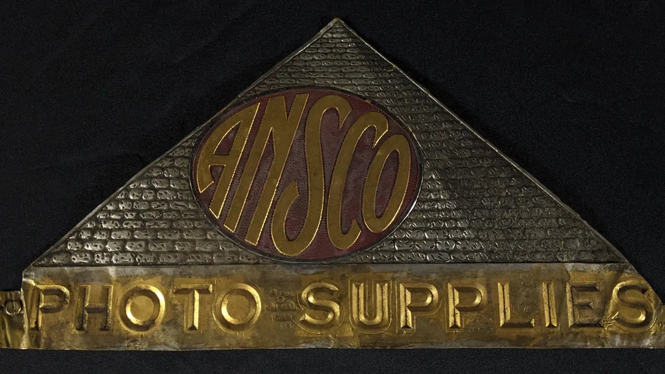 ANSCO PHOTO SUPPLIES PYRAMID SHAPED EMBOSSED BRASS SIGN