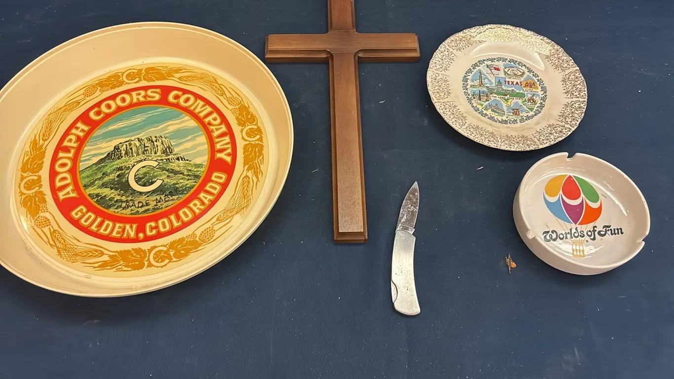 Cross, plates, and pocket knife