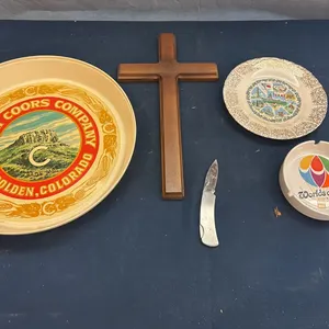 Cross, plates, and pocket knife