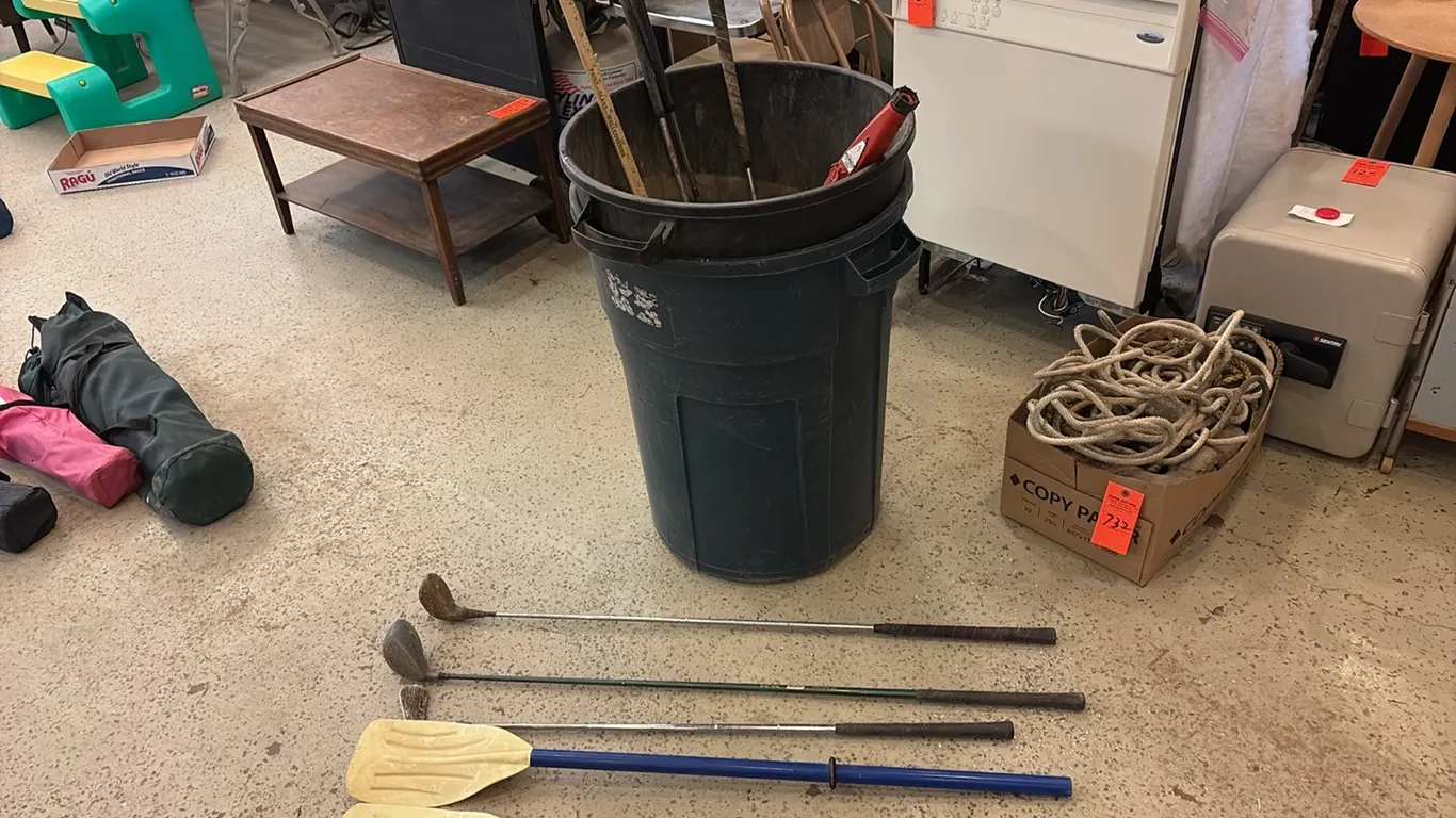 Trash Cans w/ Golf Clubs & Paddles