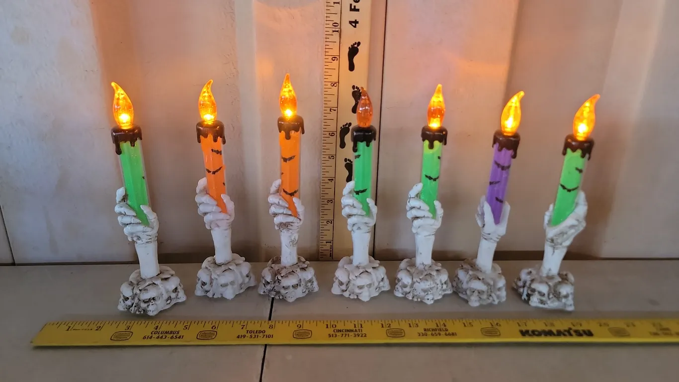7 Battery Operated Skeleton Candle Sticks (1 Missing Battery Cover)