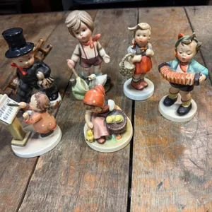 6 Hummel-Style Porcelain Figurines Depicting Children