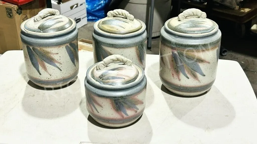 4 signed stoneware lidded cannisters