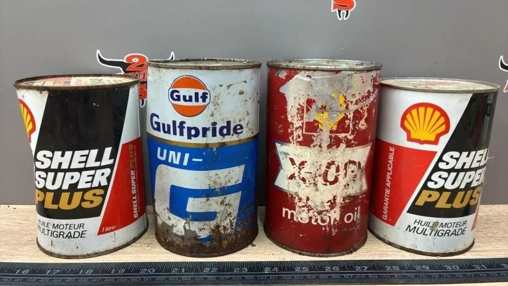 4 FULL Oil Cans. *NO SHIPPING