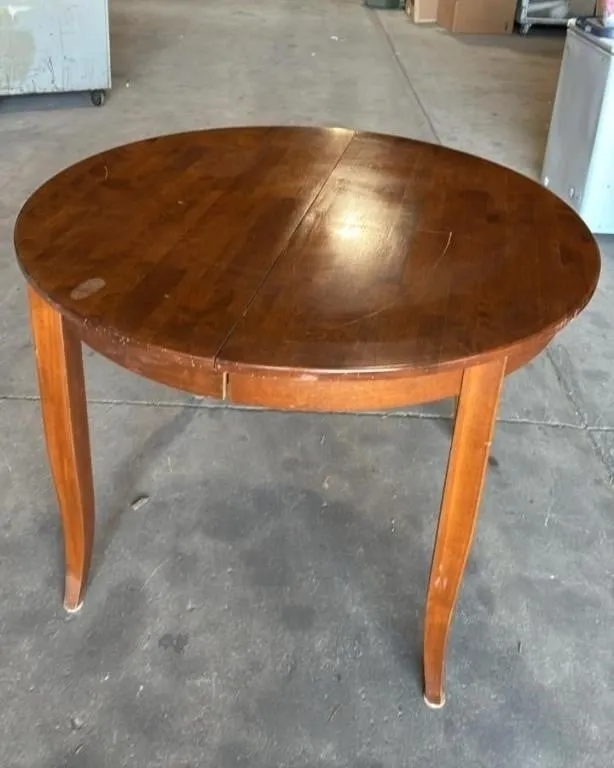 Wooden Table W/Butterfly Leaf. 42�diam/42"x52".