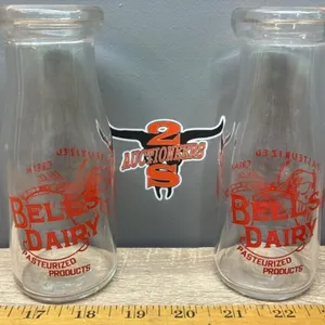 2 Vintage Bell�s Dairy Cream Bottles.