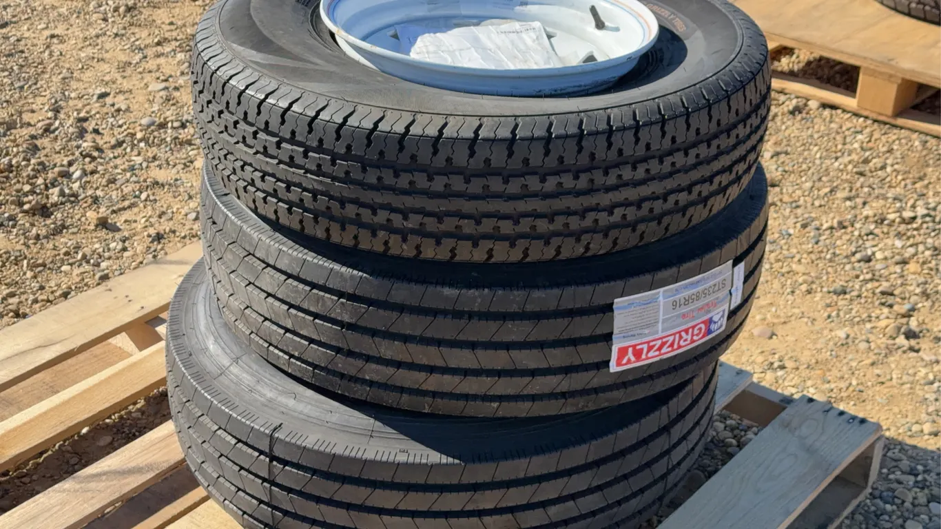 QTY of (3) ST235/80R16 Trailer Tires with Rims. Different Tread
