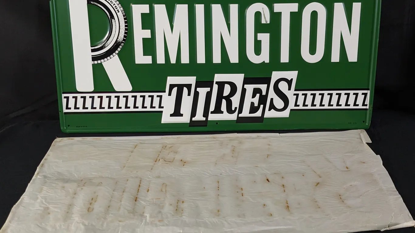 EMBOSSED TIN SIGN REMINGTON TIRES