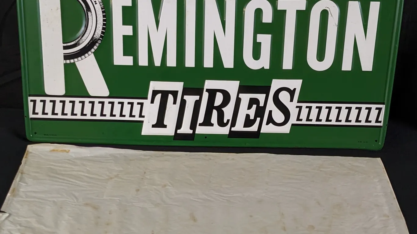 EMBOSSED TIN SIGN REMINGTON TIRES