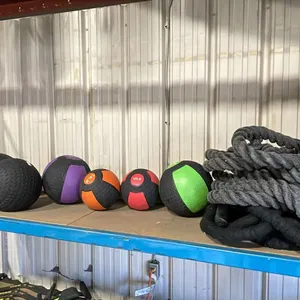 SHELF OF ASSORTED MEDICINE BALLS- ASSORTED WEIGHTS & CONDITIONING ROPES