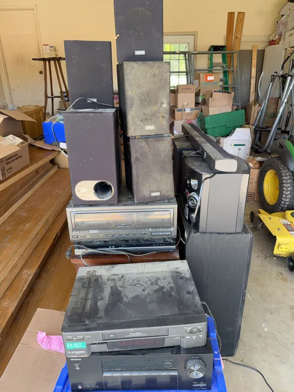 Large lot of surround sound speakers featuring Bose, Polk and Yamaha with a cassette player and DVD