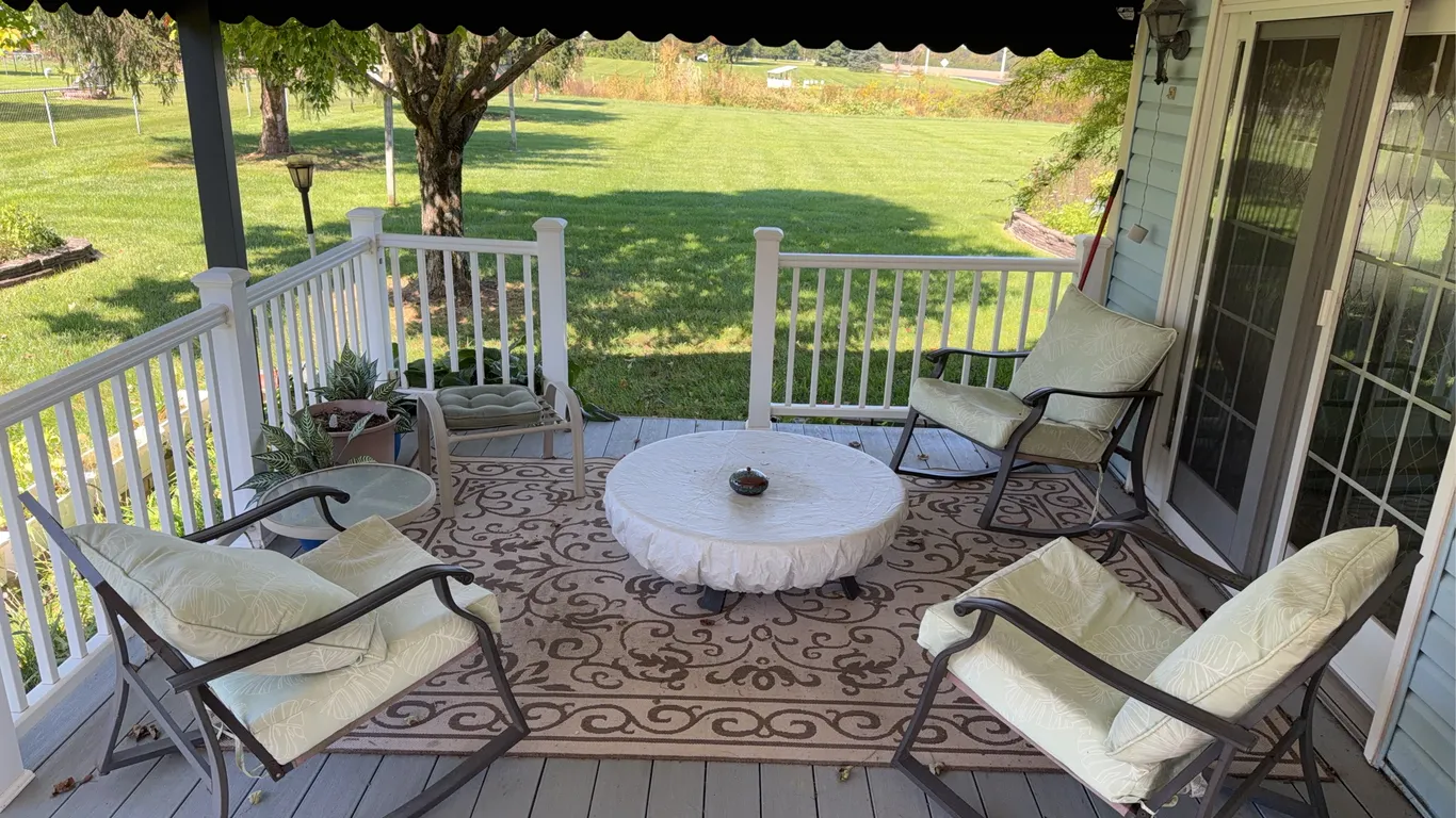 Outdoor patio set with three rocking chairs and center table 