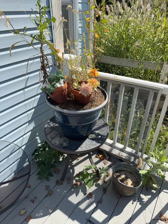 2 outdoor side tables with planters 