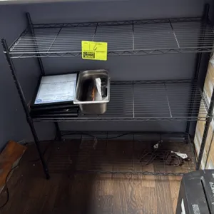 Metro-style 3-tier wire shelving rack. Features black wire construction and (3) adjustable shelves. 36" x 14" x 36". Contents not included.