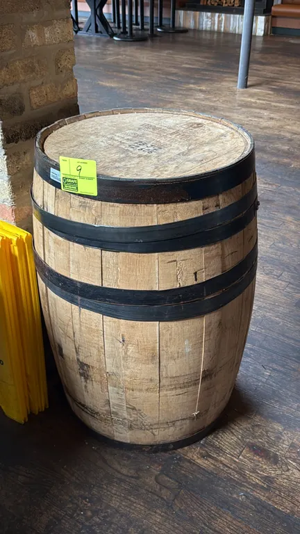 Woodinville American oak rye whiskey barrel. Features branded barrel head marked Batch No. 23-J-2, Barrel No. 42,606, Char #4 TH, and black metal hoop