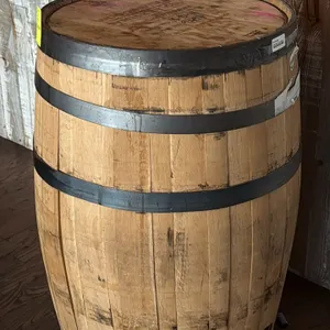 Woodinville Whiskey Co. American oak bourbon whiskey barrel. Features steel hoops, wooden bung plug, and stamped barrel head marked Batch No: 18-B-11,