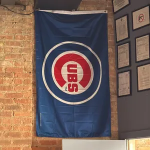 Assorted sports team flags. Includes University of South Carolina Gamecocks flags, a Chicago Cubs flag, and a Chicago Bears flag. Features printed tea